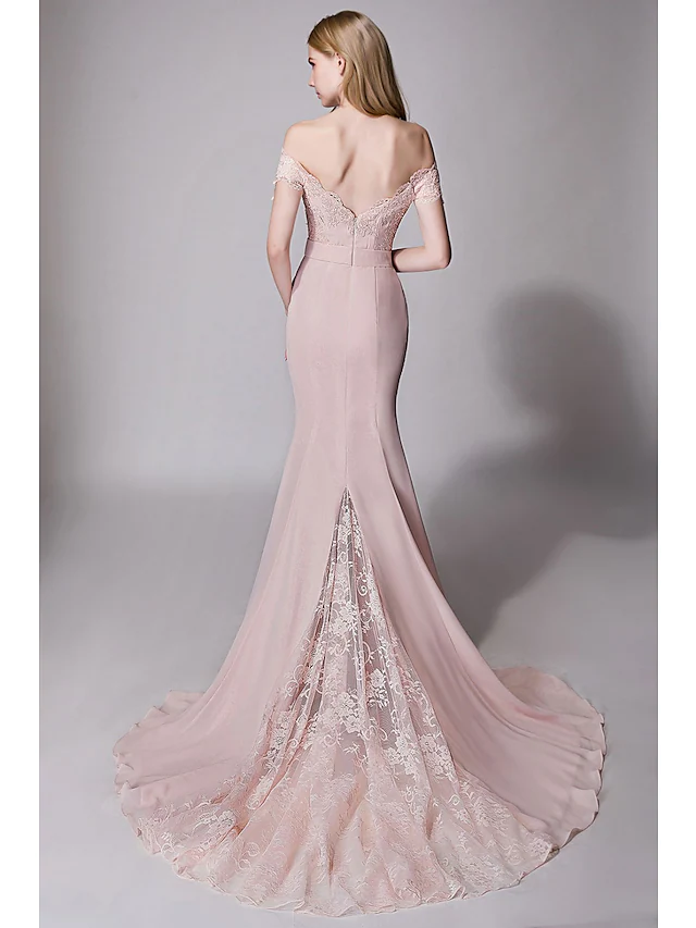 Back view of a bridesmaid dress showing the court train and lace sash.