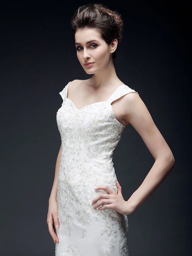 Full length view of an elegant organza satin wedding dress.