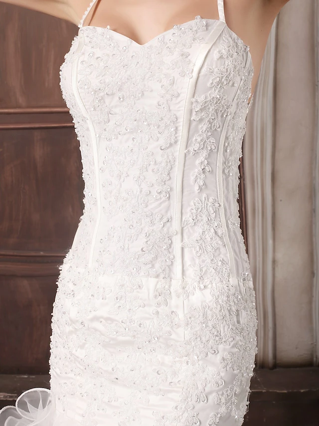 Side profile of the satin and organza wedding dress.
