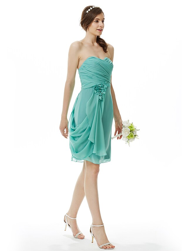 Side view of knee-length chiffon dress with floral detail.