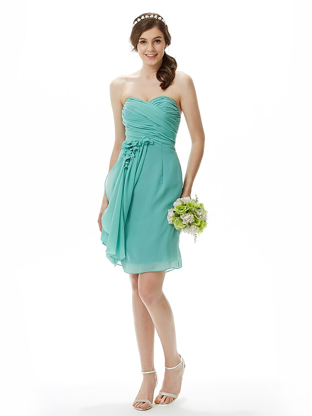 Close-up of criss-cross draping on chiffon bridesmaid dress.