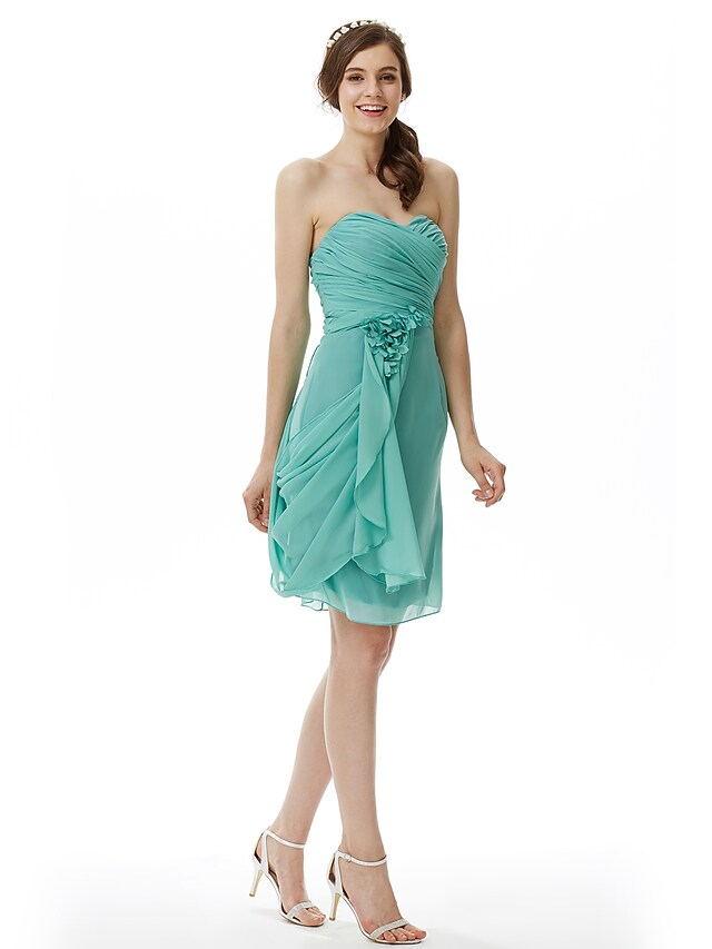 Full length view of strapless knee-length dress.