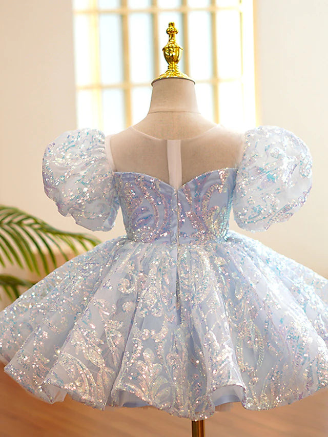 Close-up of paillette embellishments on the tulle flower girl dress.