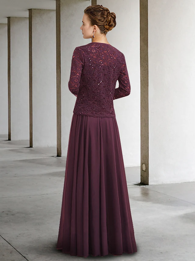 Sophisticated chiffon lace mother of the bride gown with pleated detail and floor-length skirt.