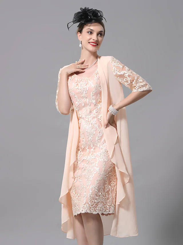 Elegant two-piece A-line Mother of the Bride dress with lace appliques and matching wrap.