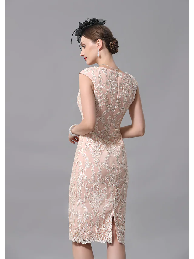 Detail of the jewel neck and bodice of the two-piece dress.