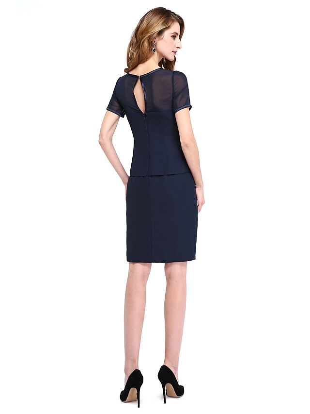 Full view of the knee-length Mother of the Bride dress with chiffon skirt.