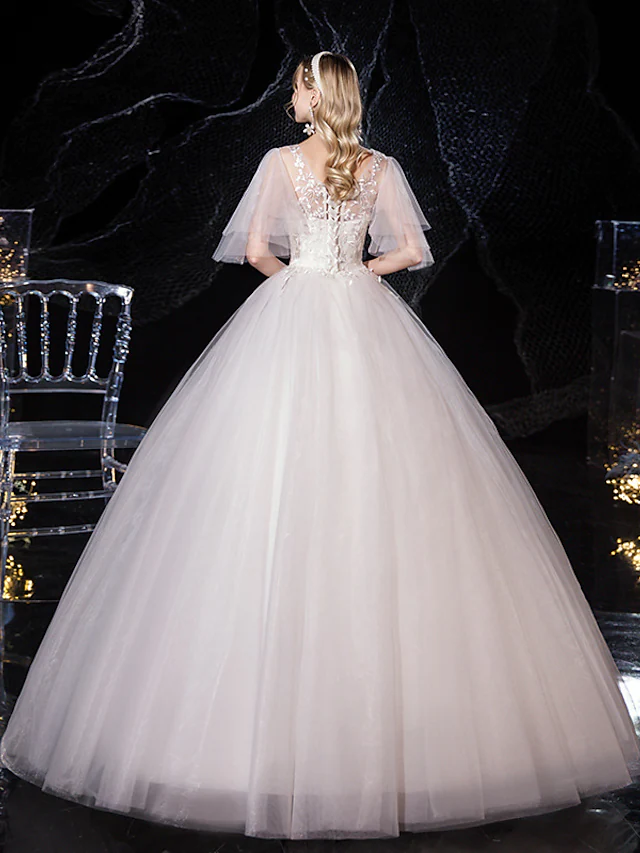 Back view of V-neck ball gown wedding dress with appliques.