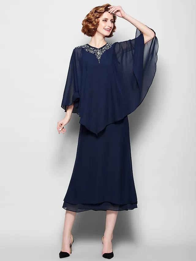 Elegant V-neck tea-length Mother of the Bride dress with 3/4 sleeves and crystal beading.
