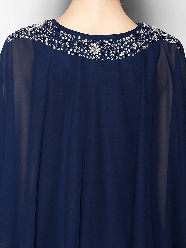 Full length view of the tea-length Mother of the Bride dress with elegant drape.