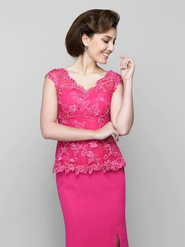Close-up of the lace and ruched detailing on the Mother of the Bride dress.