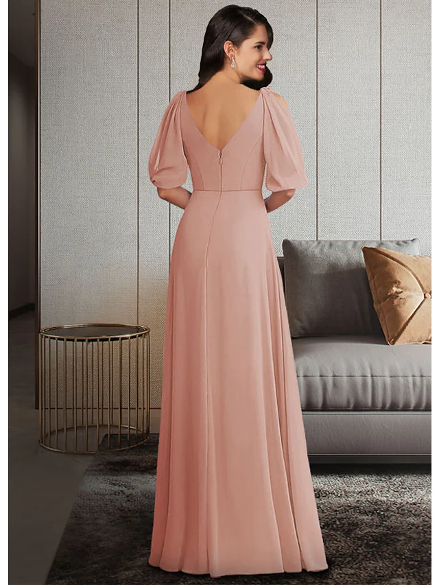 Back view of a floor-length chiffon Mother of the Bride gown with elegant ruching.
