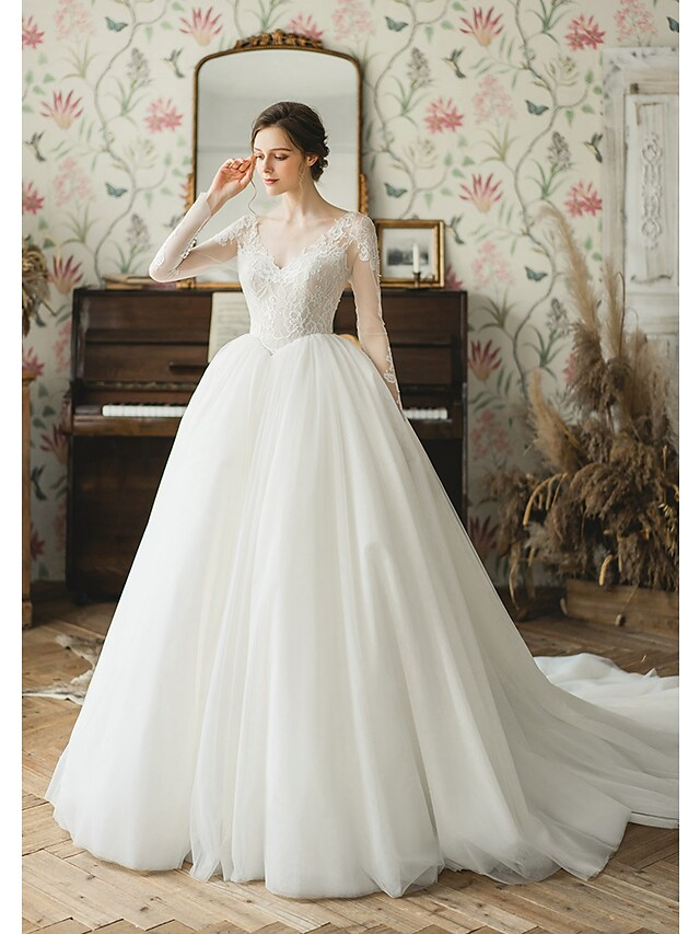 Side view of the ball gown wedding dress with chapel train.