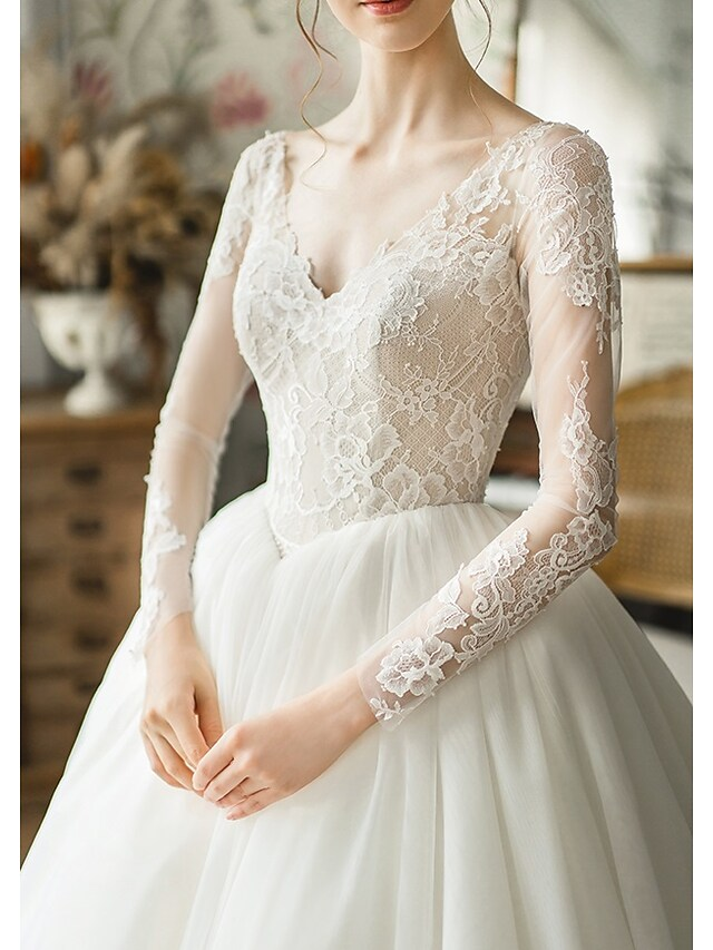 Full length view of the elegant ball gown silhouette.