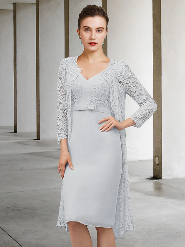 Elegant mother of the bride dress with V-neck, long sleeves, and bow detail.