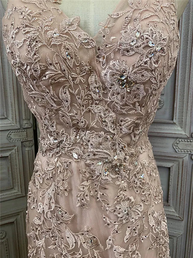 Back view of the sleeveless prom dress with appliques.