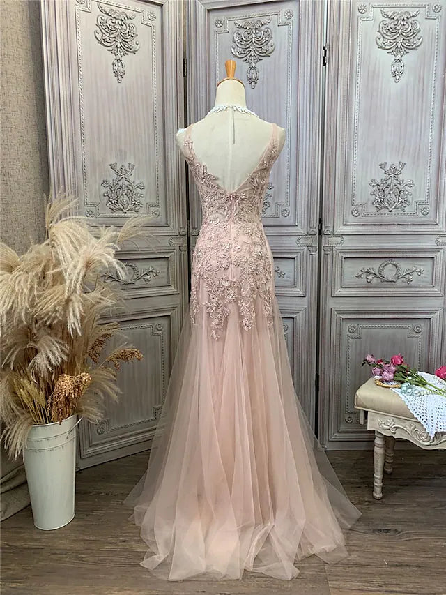 Model posing in the elegant maxi prom dress.