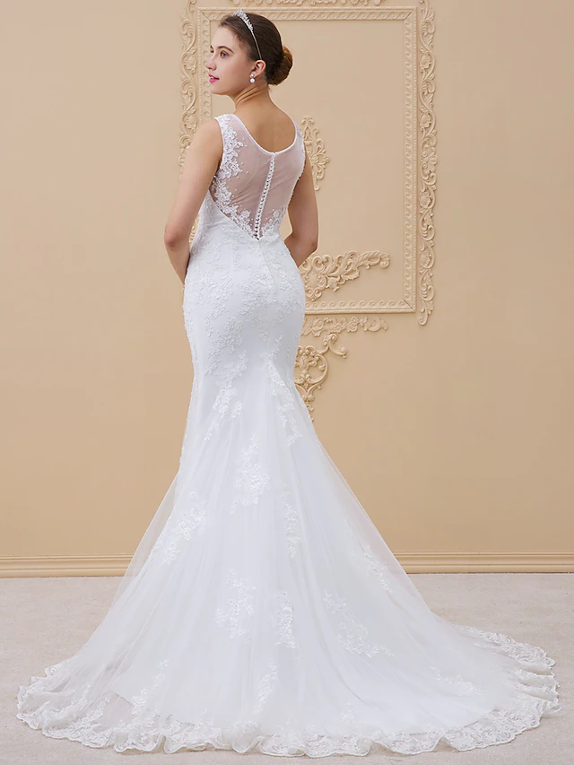 Side view of the mermaid wedding dress showing chapel train.