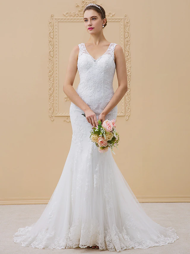 Close-up of intricate beading and lace on the V-neck bodice.