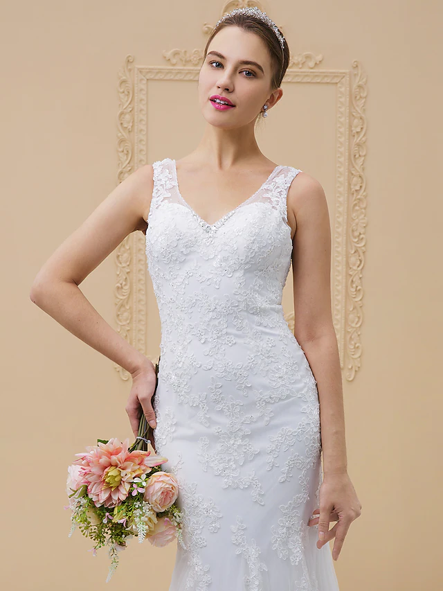 Backless wedding dress with illusion detail and regular straps.