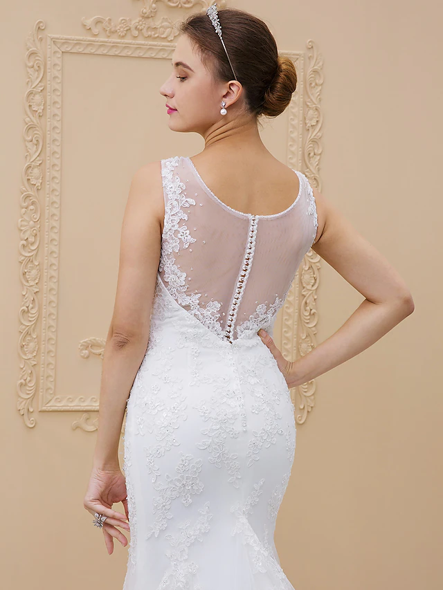 Full length V-neck bridal gown with delicate lace overlay.
