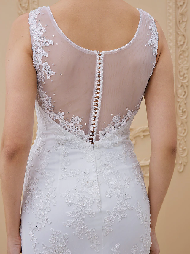 Rear view of the wedding dress showcasing the long chapel train.