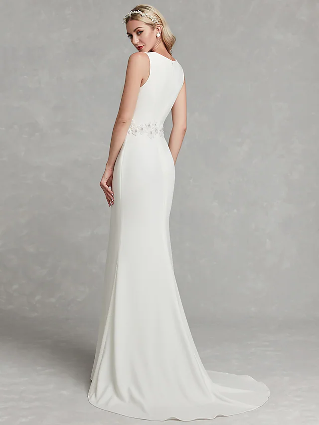 Back view of V-neck satin wedding dress with appliques.