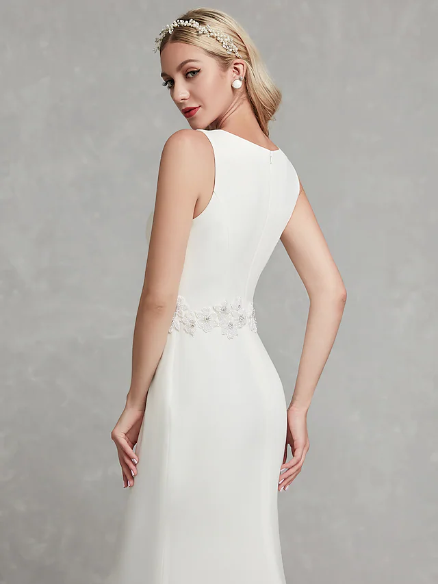 Detail of V-neckline and regular straps on wedding dress.