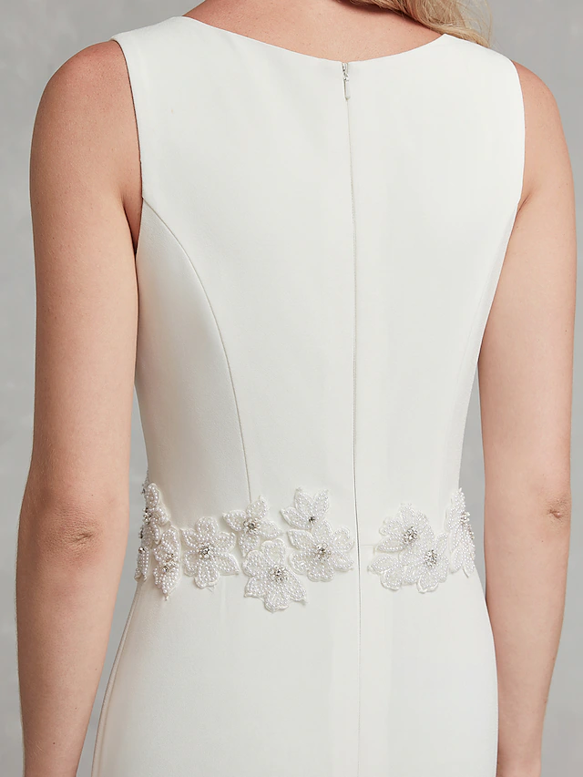 Bride wearing elegant V-neck satin wedding dress.