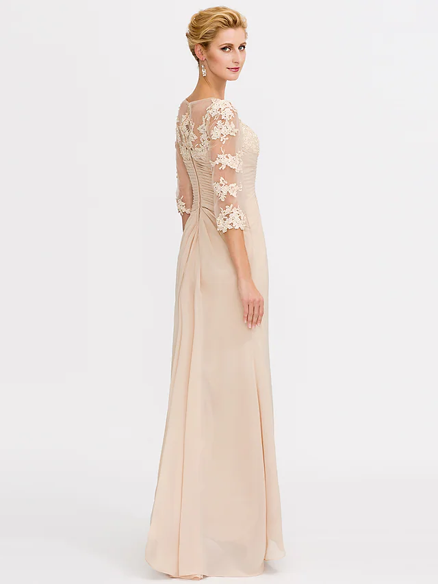Close-up of V-neckline and sheer lace appliques on an elegant gown.