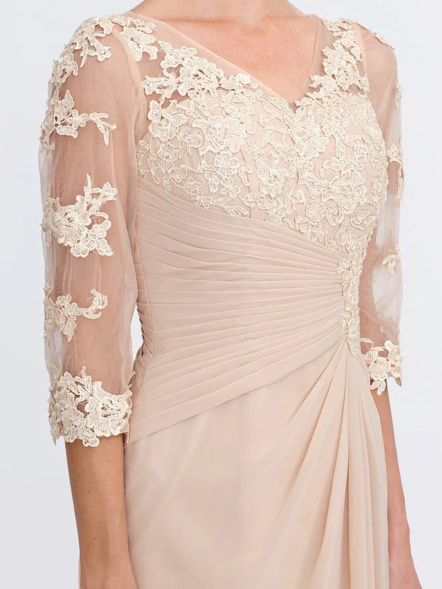 Side profile of an elegant gown featuring side draping and half sleeves.