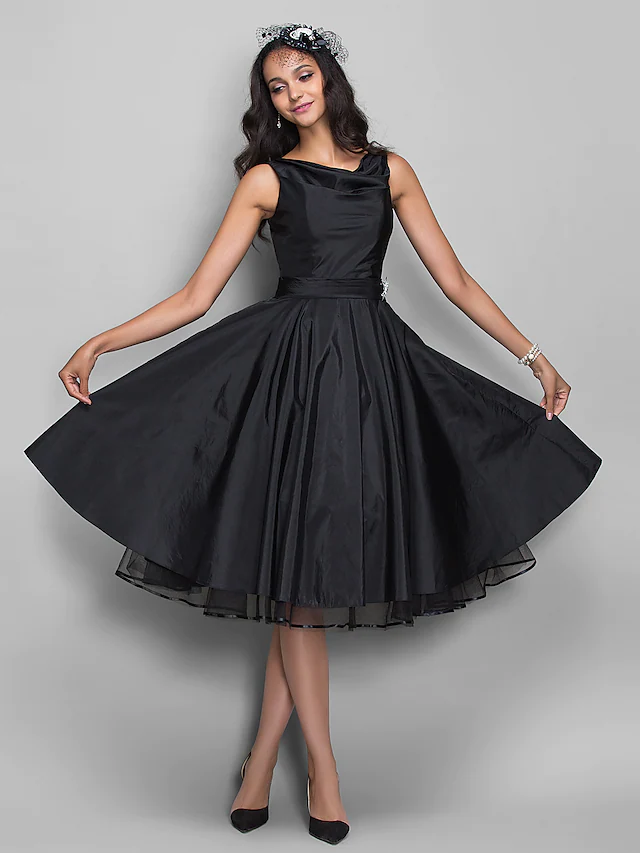 Elegant V-neck taffeta ball gown cocktail dress with pleats and crystals.