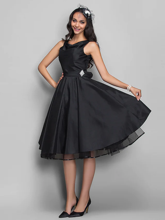 Side view of a model wearing the V-neck knee-length taffeta dress.