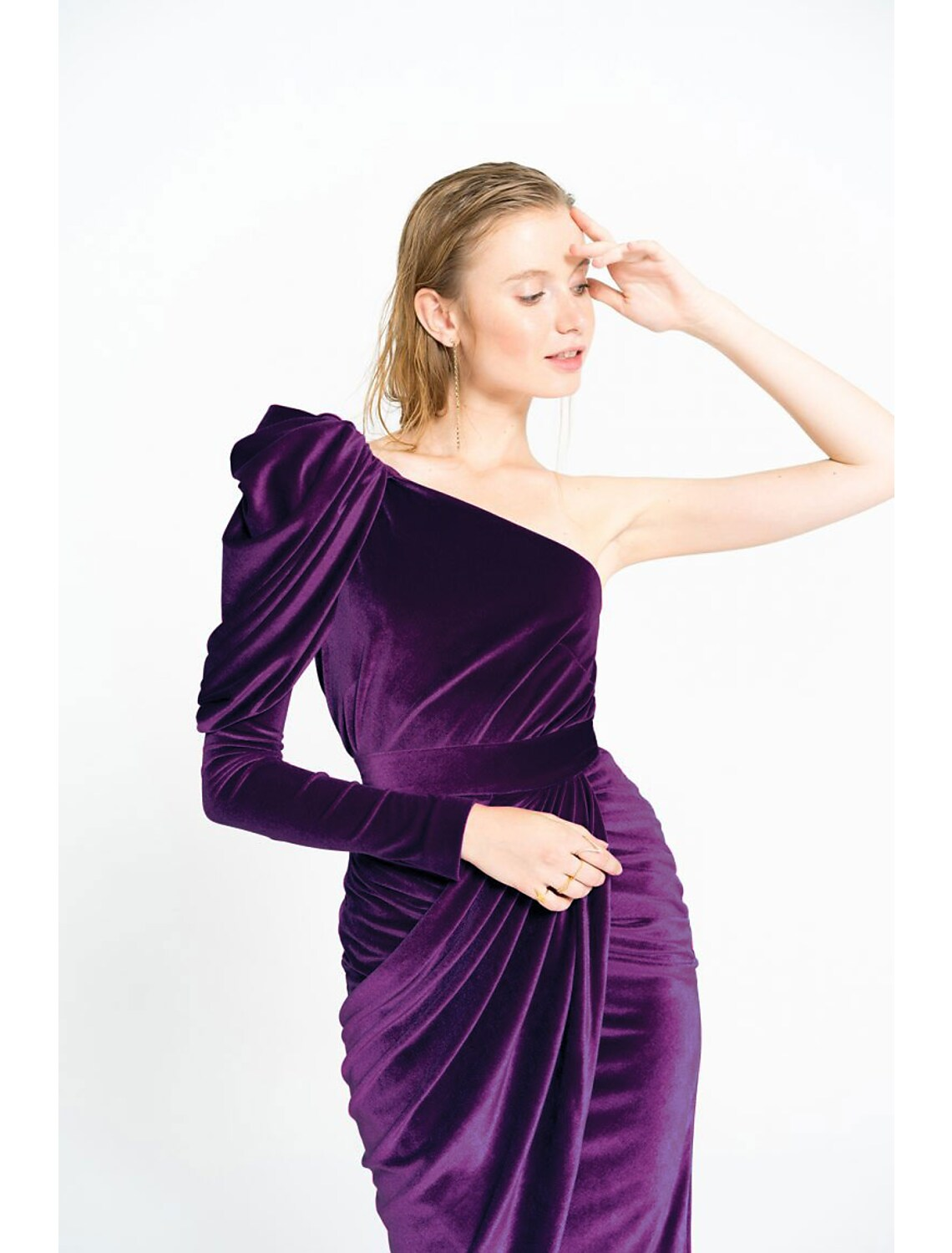 Back view of the velvet sheath dress, showing the elegant drape.