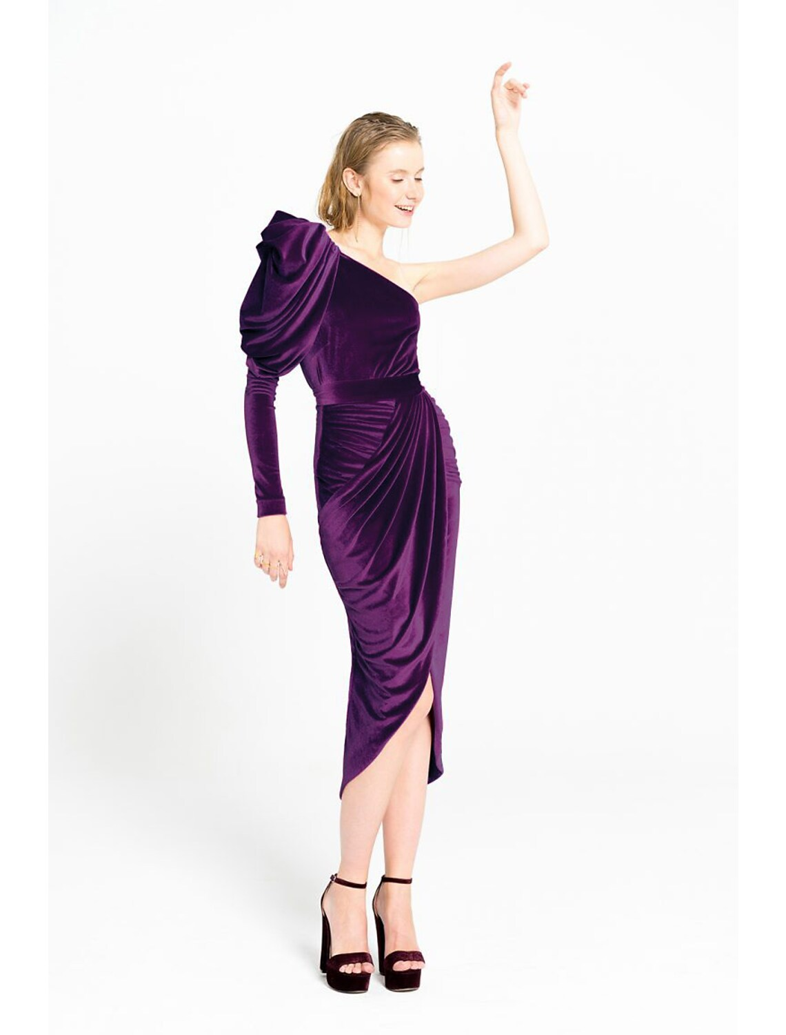 Side view of the one-shoulder velvet dress, highlighting the ruched detail.