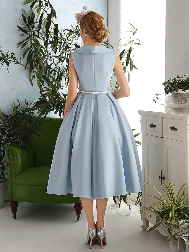 Sleeveless A-line cocktail dress, side view.