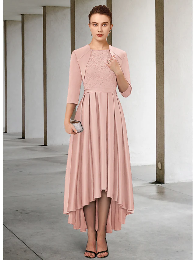 Woman in elegant navy sheath Mother of the Bride dress with jewel neck and lace details.