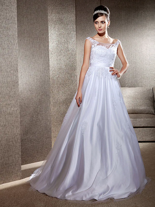 Back view of the elegant white bridal gown.