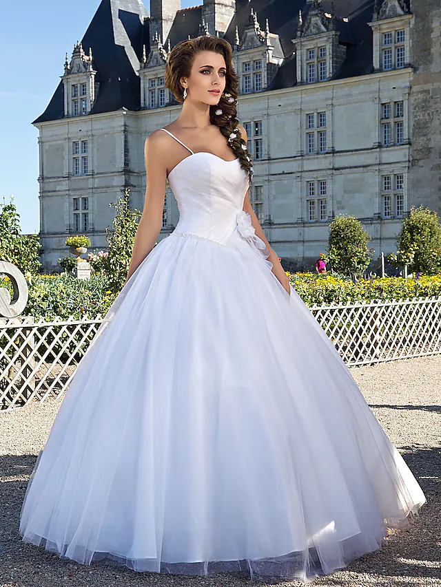 Back view of a white tulle ball gown wedding dress.