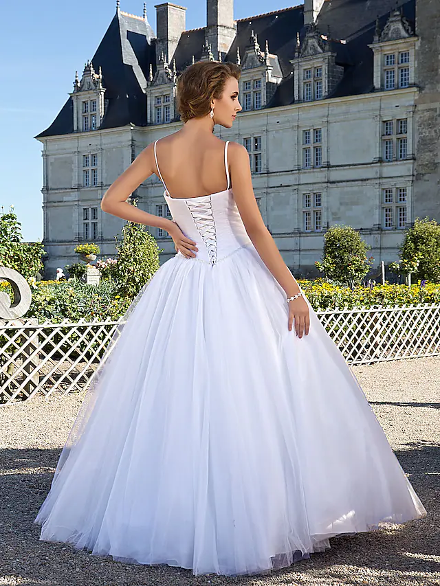 Side view of the elegant white ball gown wedding dress.