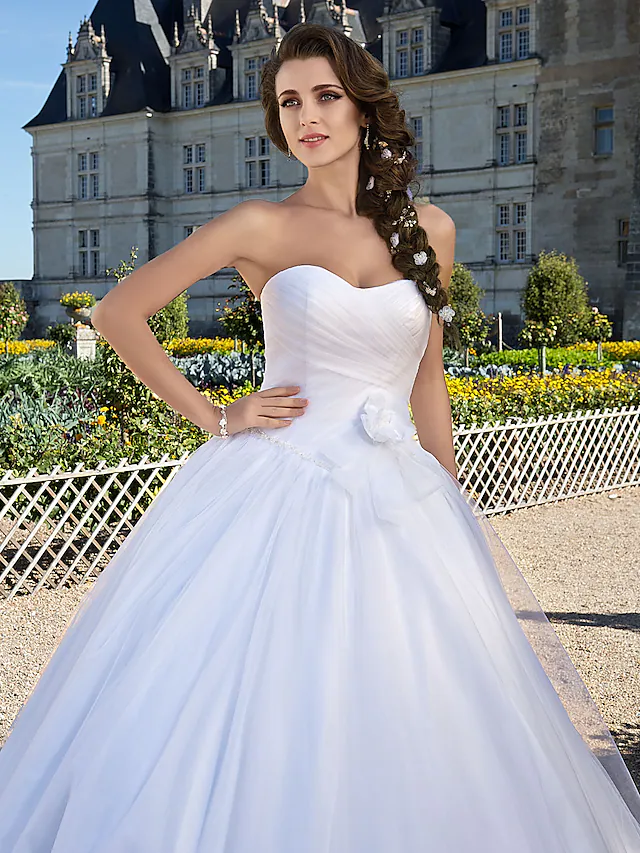 Full length view of the white sweetheart ball gown.