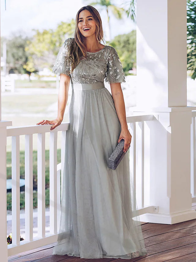 Woman wearing a solid color short sleeve round neck swing maxi dress.