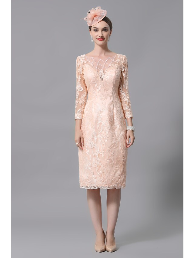 Close-up of lace details and appliques on a formal dress sleeve.