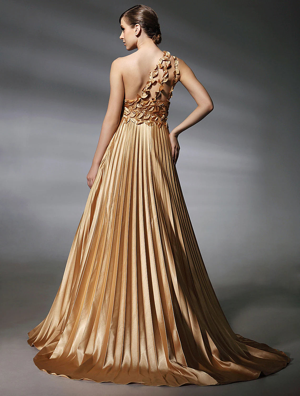 Formal evening dress featuring a one-shoulder design and sweep train.