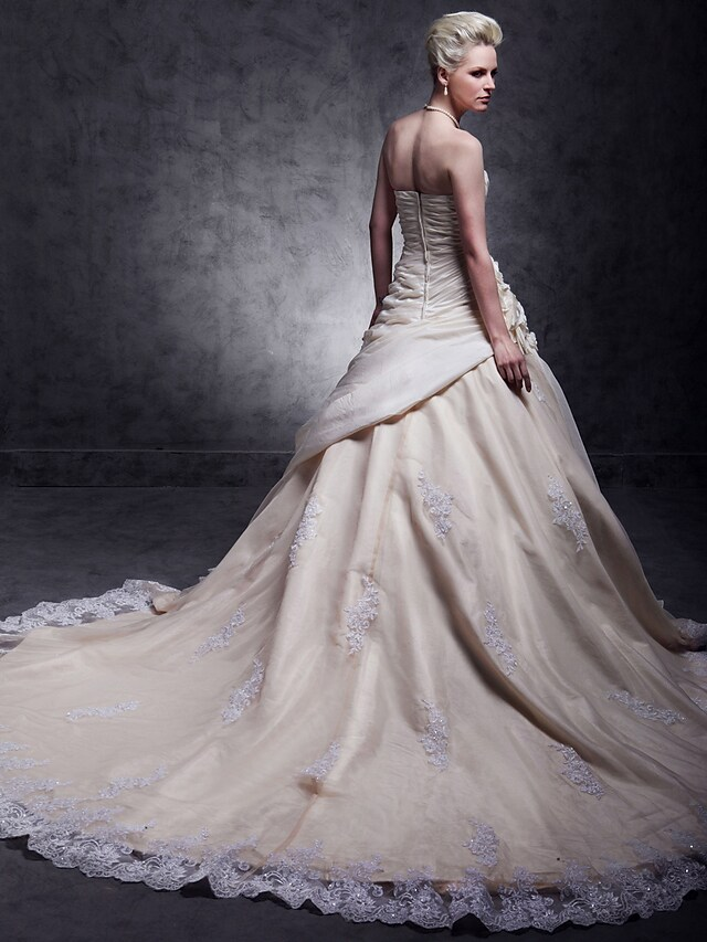 Taffeta wedding gown with intricate beading and lace.