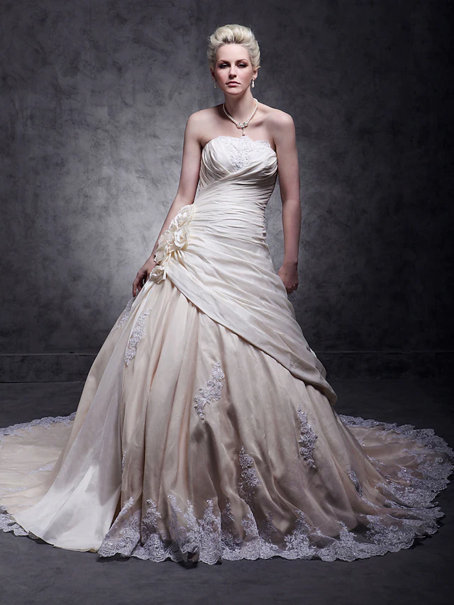 Full view of A-Line strapless wedding dress with train.