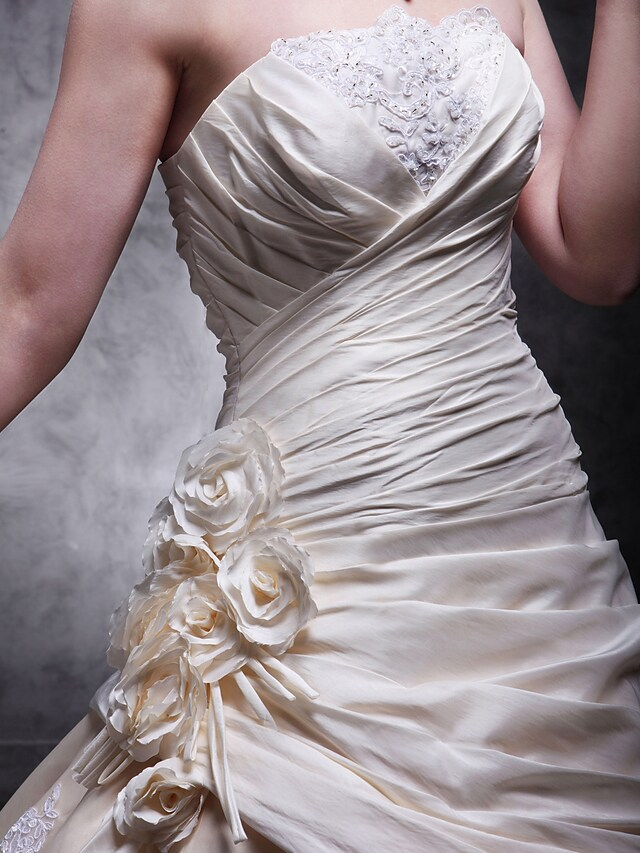 Back detail of cathedral train on A-Line wedding dress.