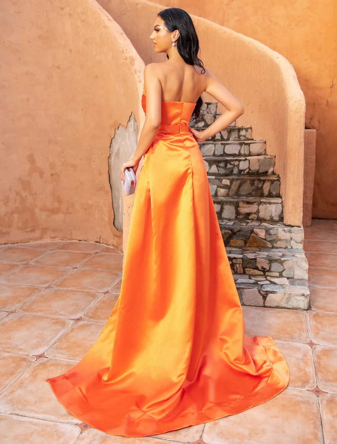 Formal A-line dress in satin with a sweep train and crystal details.