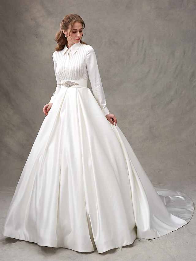 Side view of the glamorous satin wedding dress with a bowknot detail.