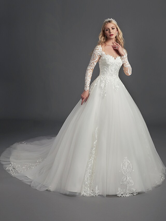 Side view of a bride in the elegant ball gown wedding dress, highlighting the silhouette.